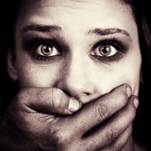 hand_over_mouth_woman_300x300_istock_0